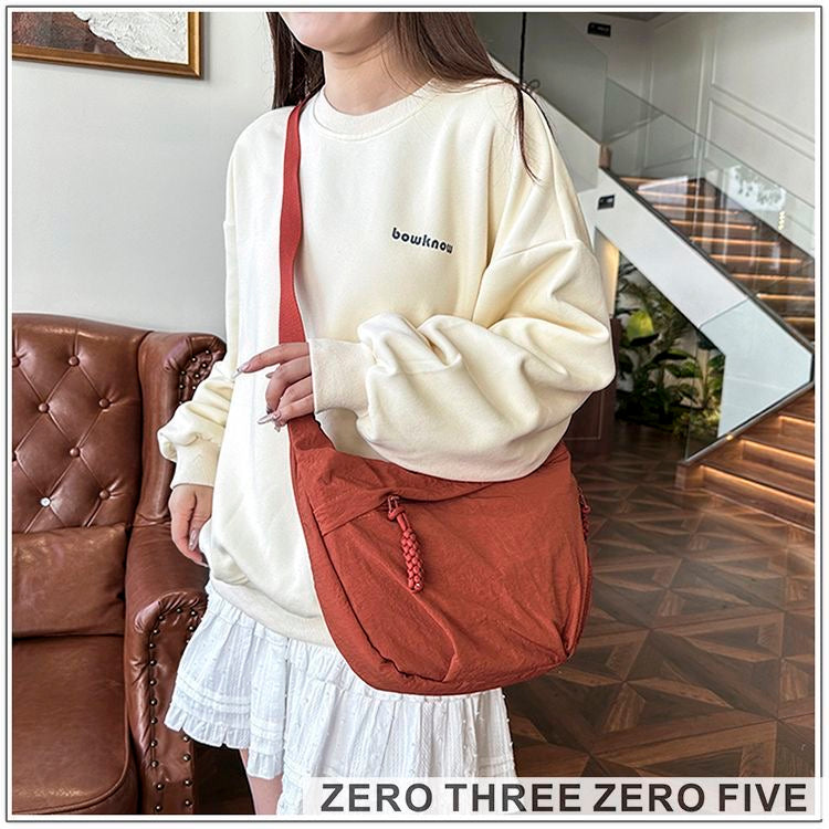 A crossbody dumpling bag Shoulder Bags