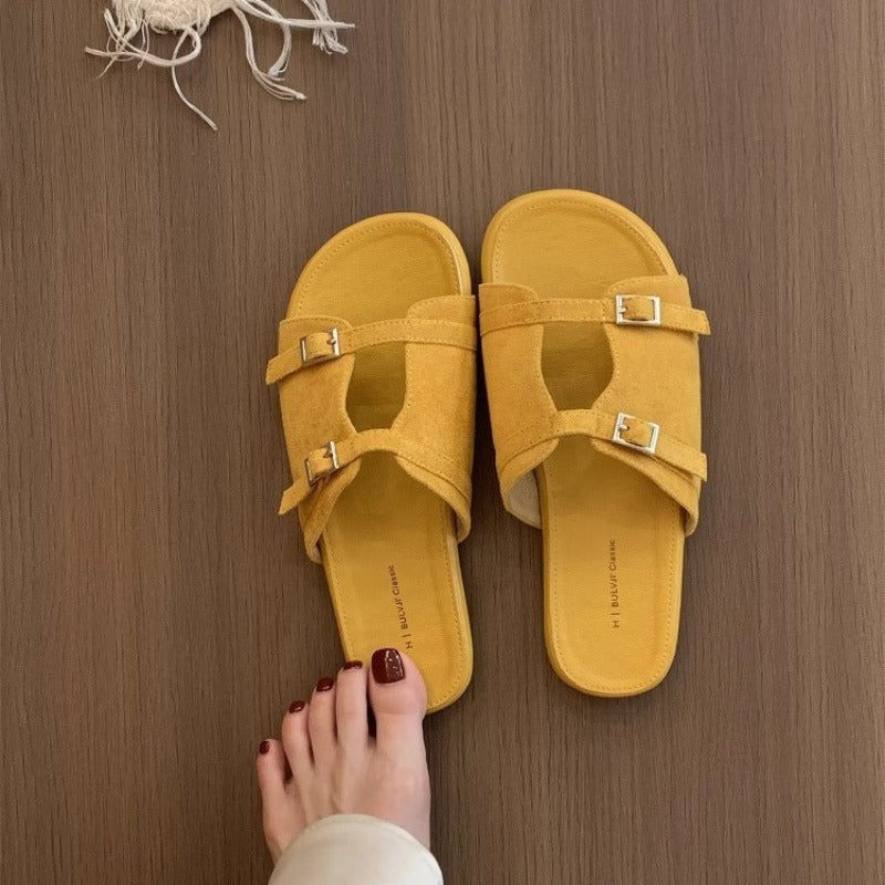 Korean version of niche hollow belt buckle flat bottom one-word open-toe cool slippers women's 2025 new casual vacation sandals