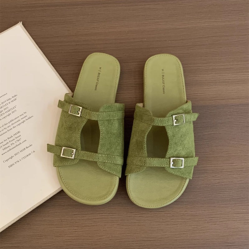 Korean version of niche hollow belt buckle flat bottom one-word open-toe cool slippers women's 2025 new casual vacation sandals