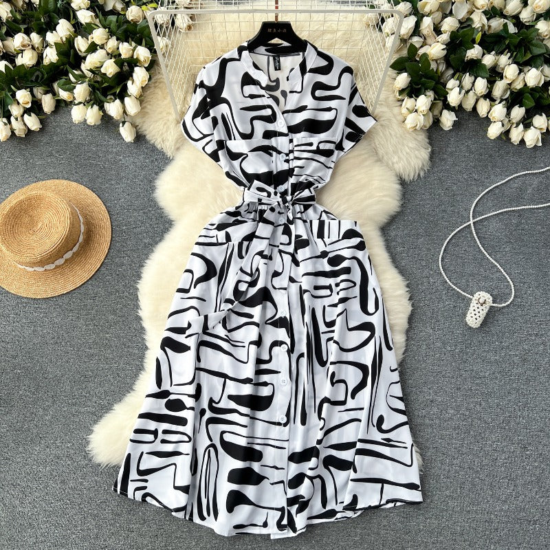 European and American style holiday dress women's 2025 new design sense printing strap waist thin medium and long knee skirt